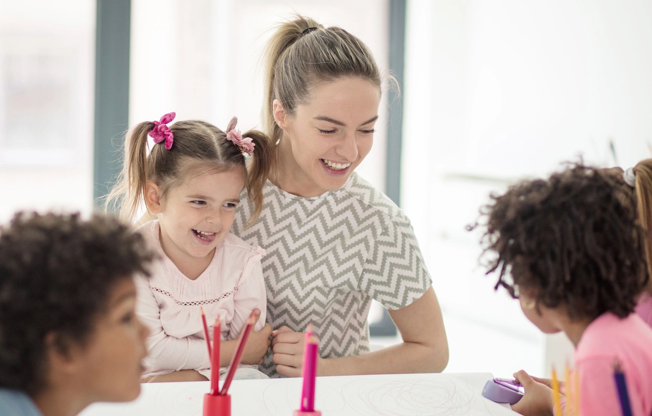 Children in preschool learning and playing together