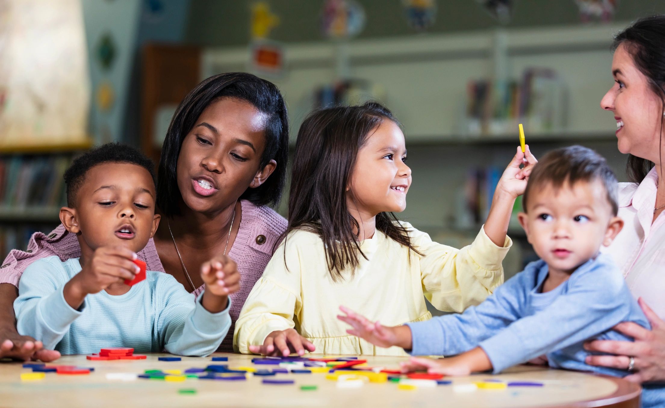 Children playing with colorful shapes